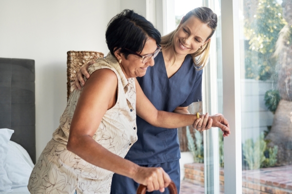 Nursing staff help a lady